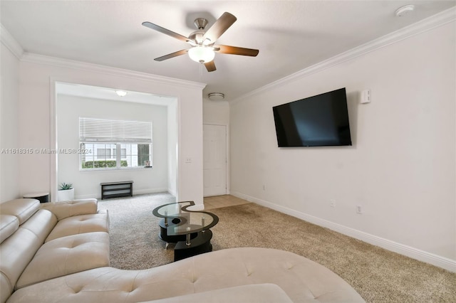 carpeted living room with ornamental molding and ceiling fan