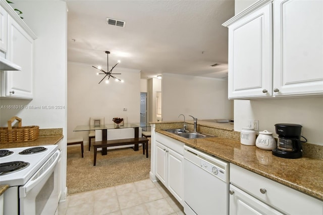 kitchen featuring white appliances, white cabinetry, sink, and a chandelier