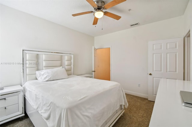 200 Southern Pecan Cir Unit 105, Winter Garden, FL 34787 - bedroom featuring dark colored carpet and a ceiling fan