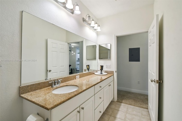 bathroom with tile patterned floors, electric panel, and vanity