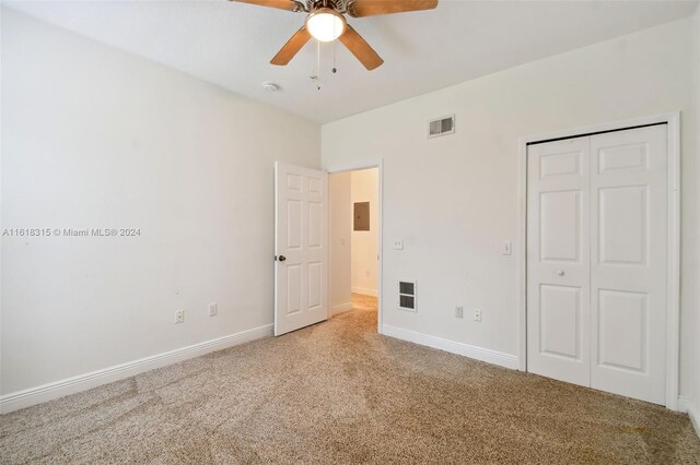 200 Southern Pecan Cir Unit 105, Winter Garden, FL 34787 - unfurnished bedroom with carpet floors, a closet, and ceiling fan
