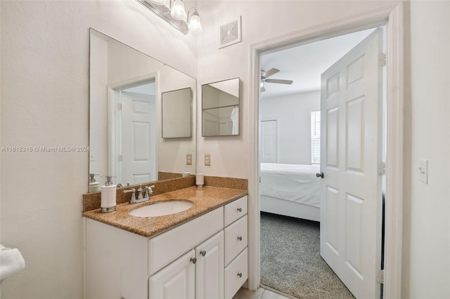 bathroom featuring ceiling fan and vanity