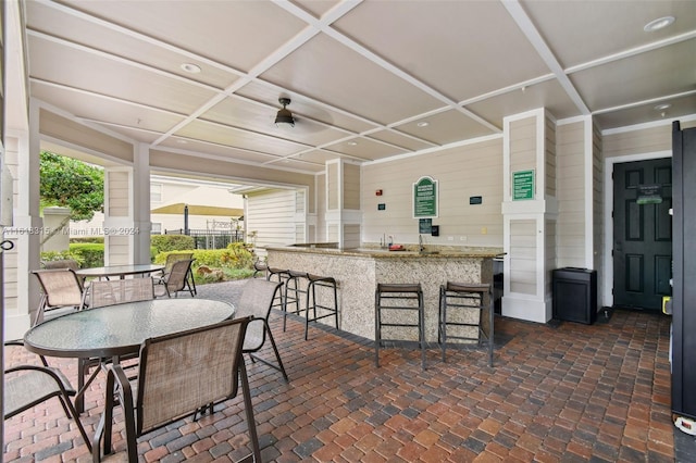 view of patio featuring exterior bar