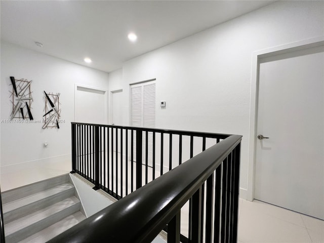 hallway with tile patterned floors