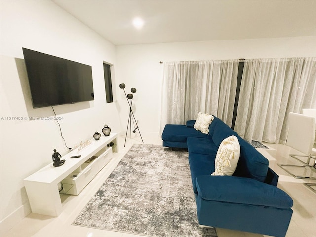 living room with tile patterned floors