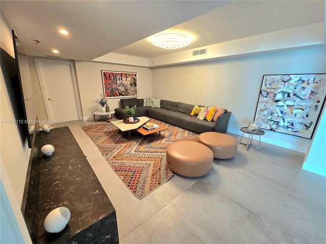 living room featuring concrete flooring