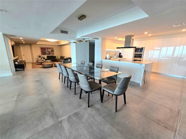 dining room with a tray ceiling