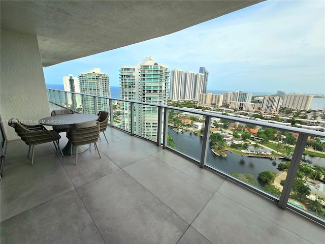 balcony featuring a water view