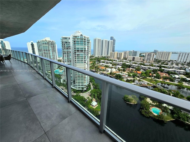 balcony featuring a water view