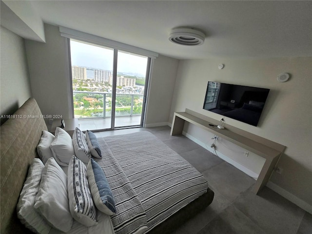 bedroom featuring floor to ceiling windows