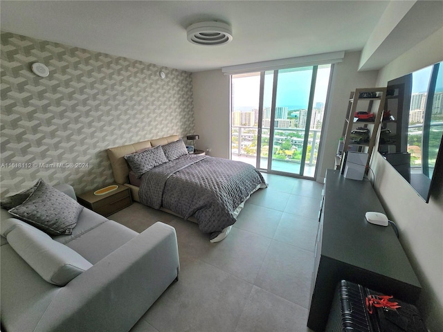 bedroom featuring floor to ceiling windows