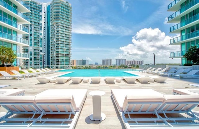 view of swimming pool with a patio