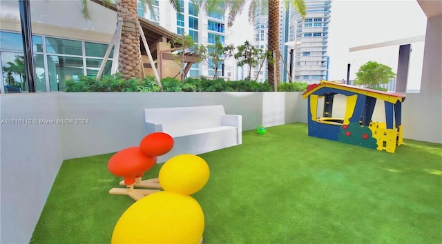 view of play area featuring a lawn