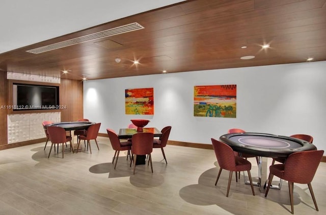 game room featuring wood ceiling and light hardwood / wood-style floors