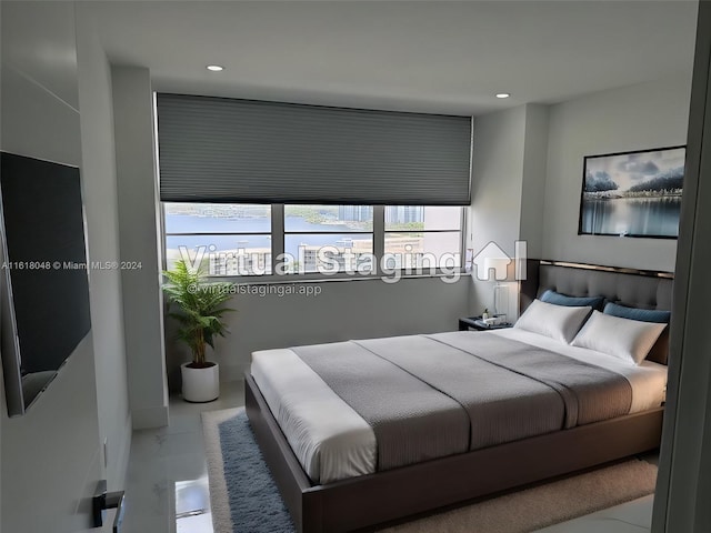 tiled bedroom featuring multiple windows