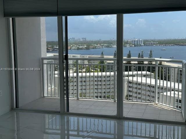 balcony featuring a water view