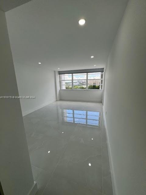 unfurnished room with tile patterned floors