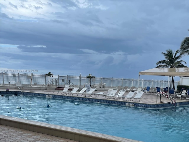 view of swimming pool featuring a patio area