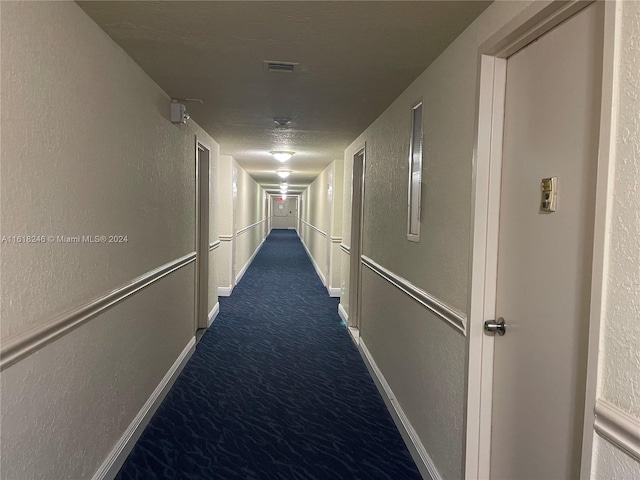 hallway featuring carpet