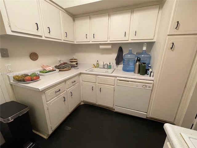 kitchen with sink, dishwasher, and white cabinetry