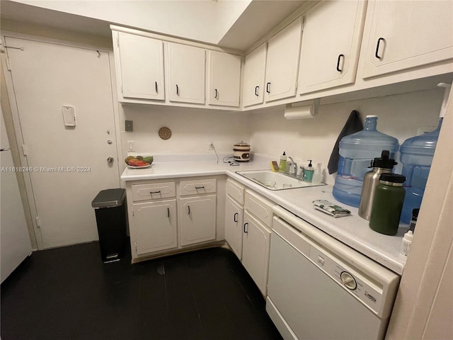 kitchen featuring sink, dishwasher, dark hardwood / wood-style floors, and white cabinetry