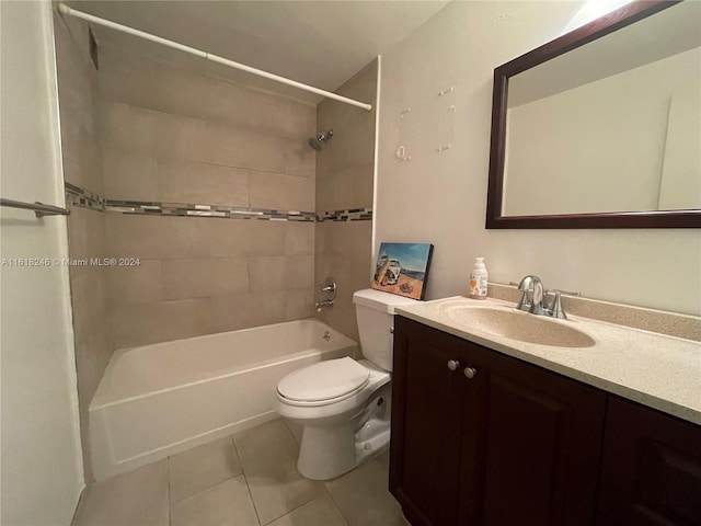 full bathroom with vanity, tiled shower / bath, tile patterned floors, and toilet