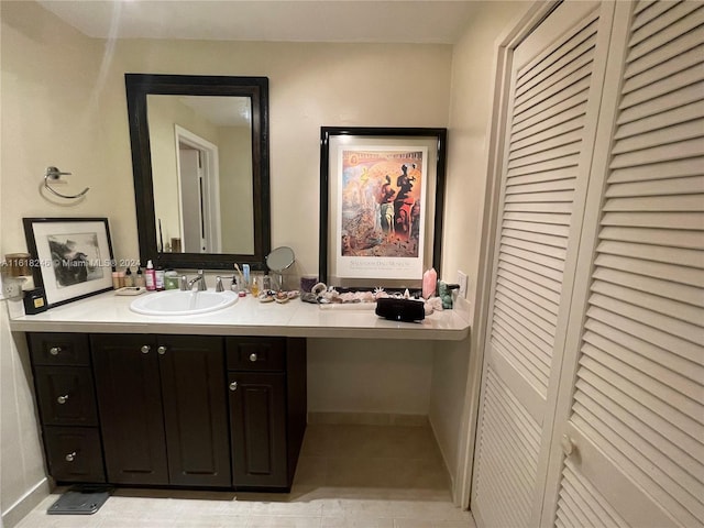 bathroom with vanity and tile patterned flooring