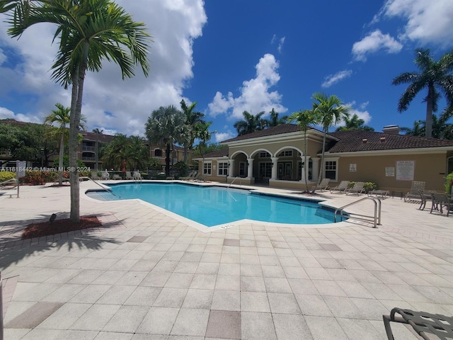 view of swimming pool featuring a patio area