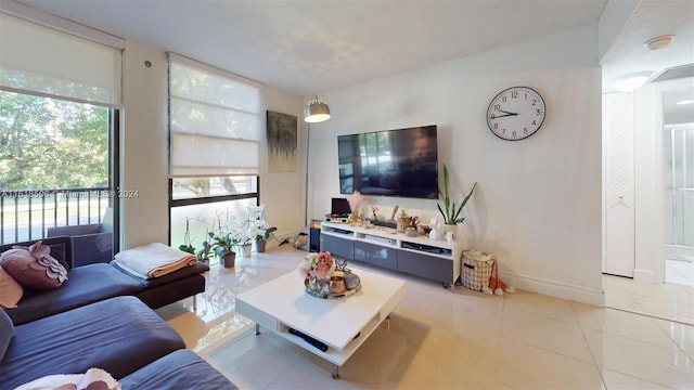 tiled living room with expansive windows