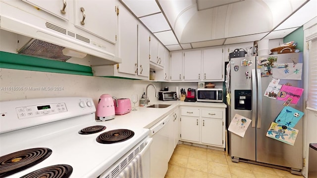 kitchen featuring stainless steel appliances, sink, and white cabinets