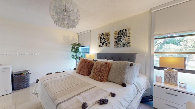 bedroom with light tile patterned flooring