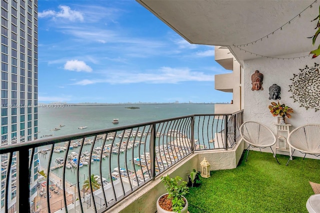 balcony featuring a water view