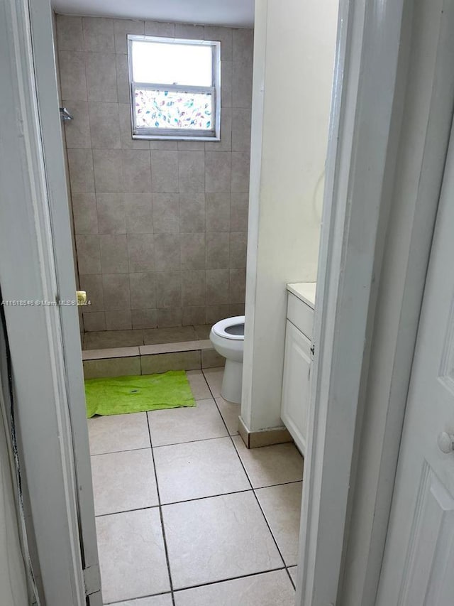 bathroom with tile patterned floors, vanity, and toilet