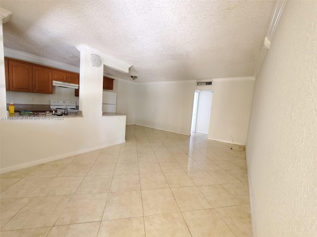 unfurnished living room with ornamental molding, light tile patterned flooring, and a textured ceiling