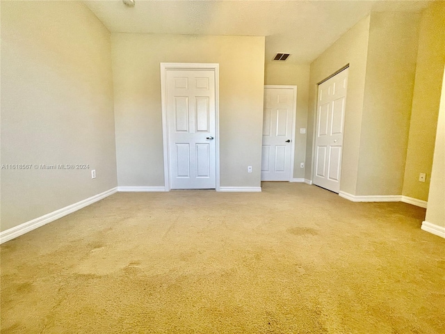 unfurnished bedroom featuring carpet flooring