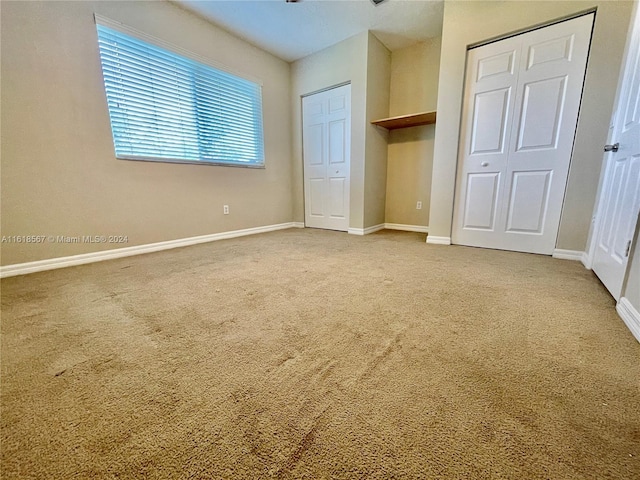 unfurnished bedroom featuring carpet floors