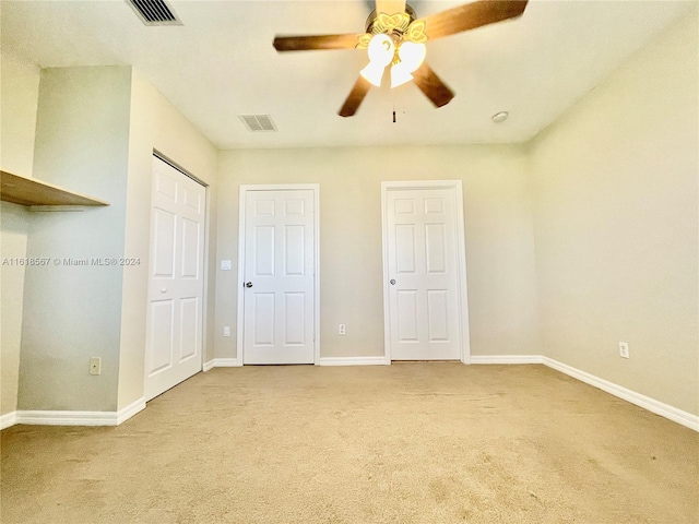 unfurnished bedroom featuring carpet and ceiling fan