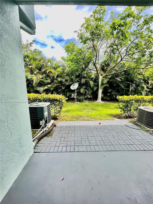 view of patio with central air condition unit