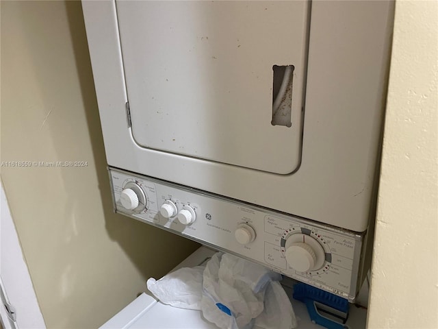 laundry room with stacked washer and clothes dryer