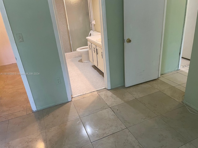 hallway with light tile patterned floors