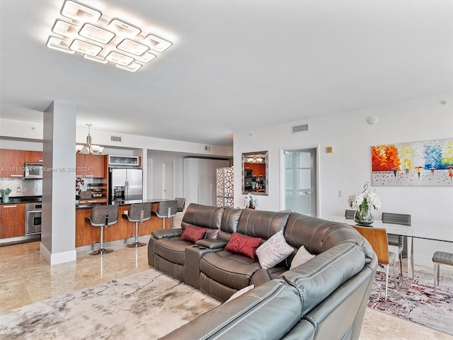 living room featuring a chandelier