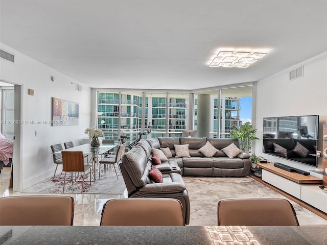 living room featuring a wall of windows