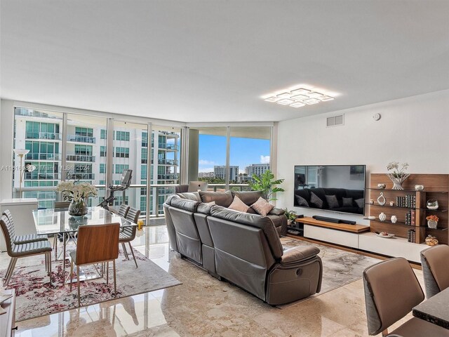 living room featuring floor to ceiling windows