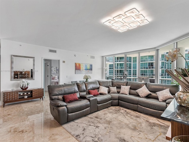 living room featuring a wall of windows