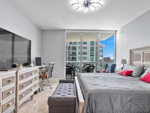 bedroom featuring floor to ceiling windows