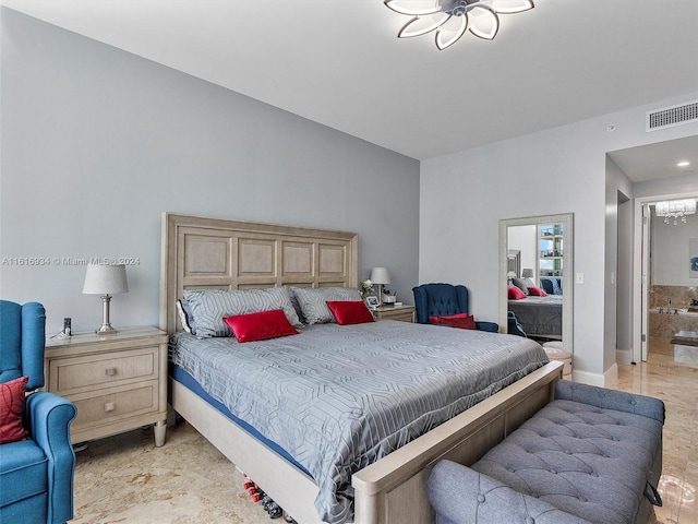 bedroom with a notable chandelier