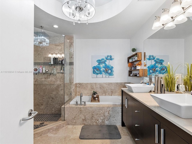 bathroom with tile patterned floors, a notable chandelier, dual bowl vanity, and separate shower and tub