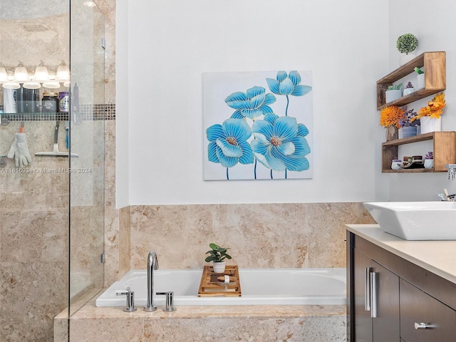 bathroom featuring vanity and shower with separate bathtub