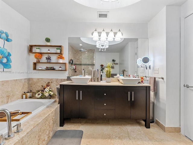 bathroom with vanity and independent shower and bath