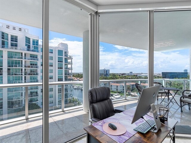 office featuring floor to ceiling windows and plenty of natural light